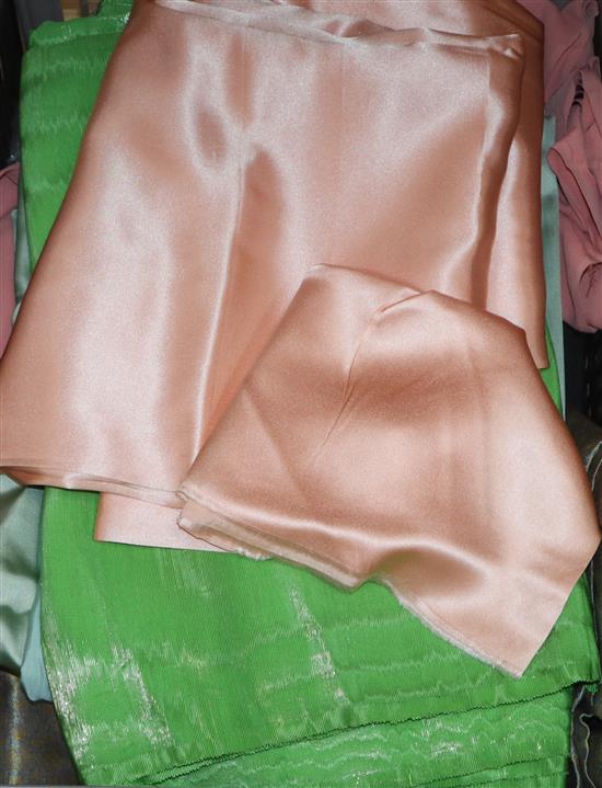 A 1930s length of lime green silk, another length of crepe de shine peach satin, etc